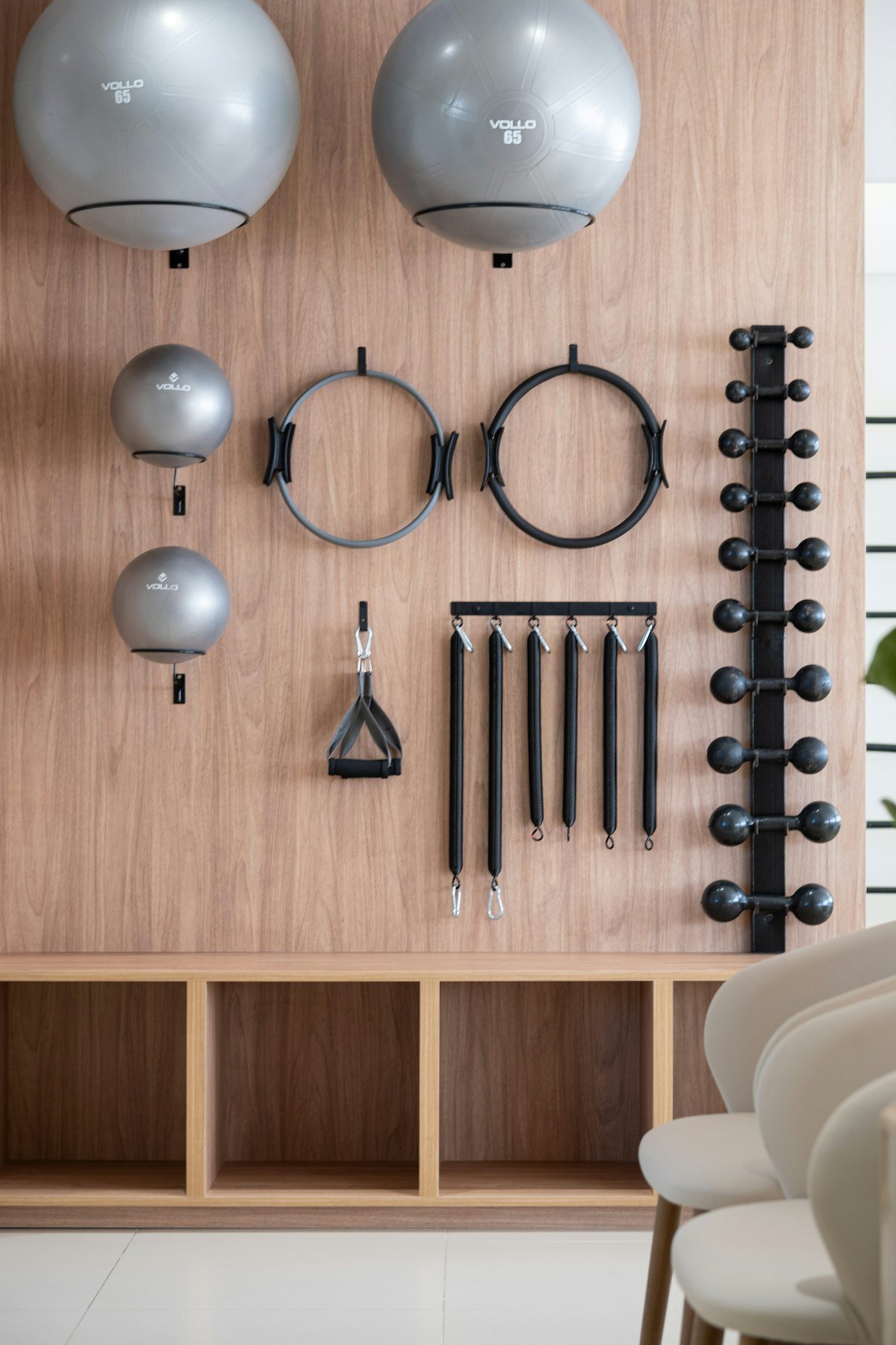 Training equipment neatly organised on a wooden wall