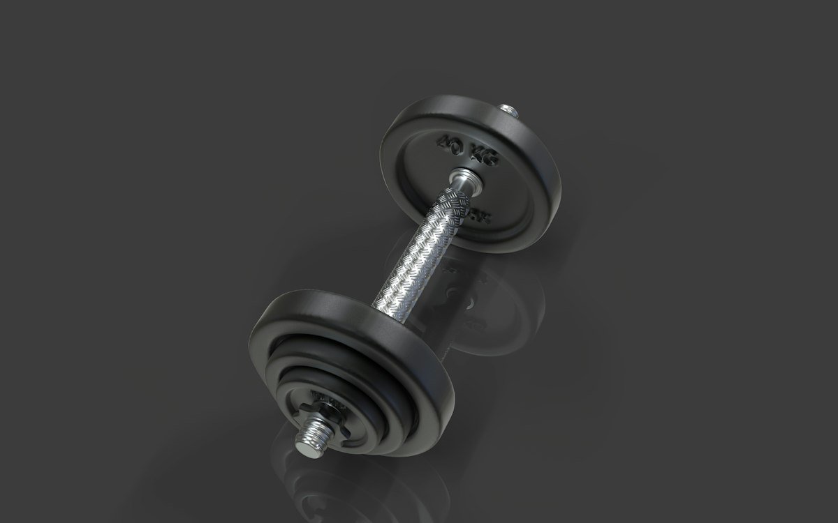 Plate-loaded adjustable dumbbell on a black background