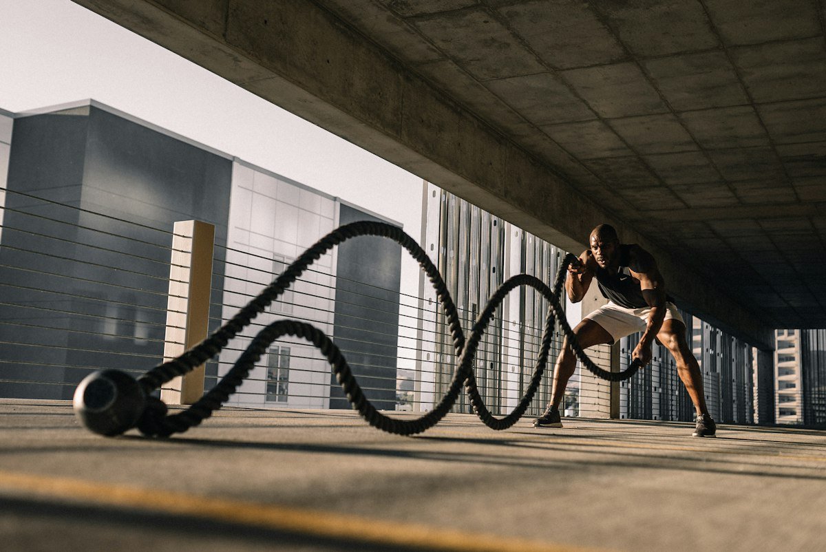 Battle ropes laid out on a gym floor
