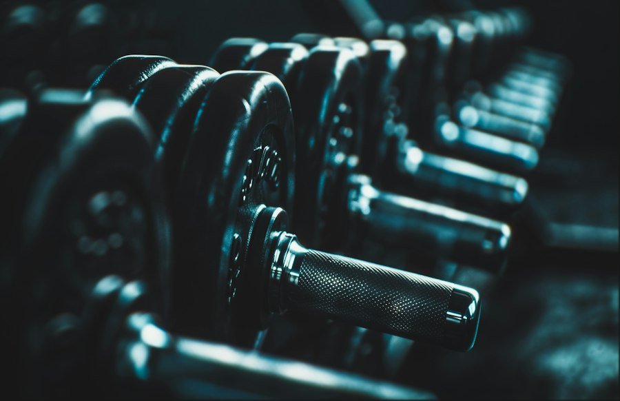 Row of dumbbells on a rack in low light