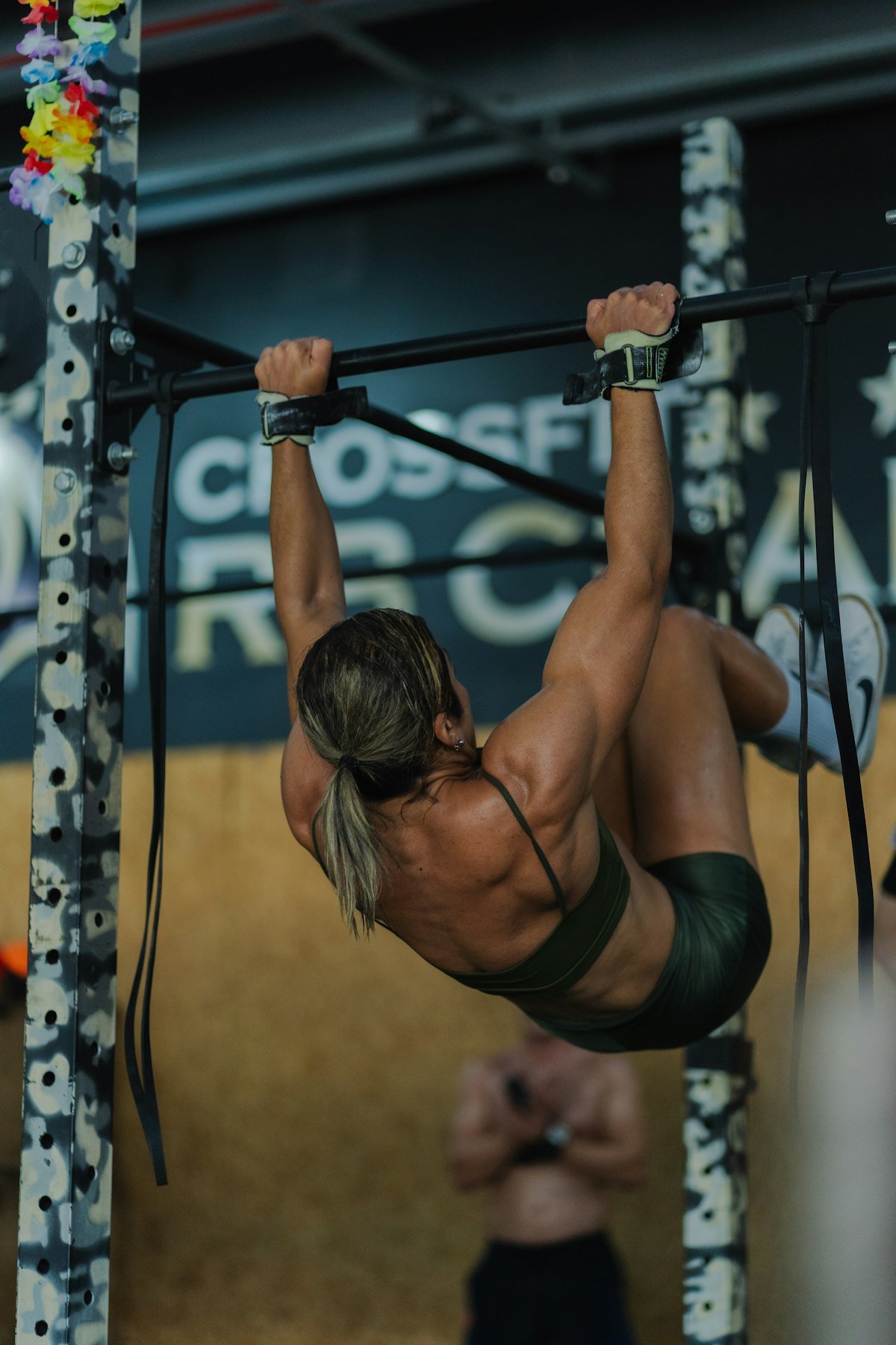 Person doing pull-ups on a bar